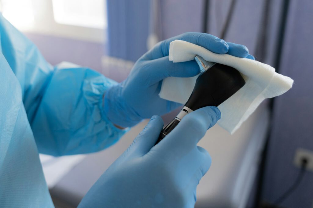 close up of a doctor's hands cleaning medical material