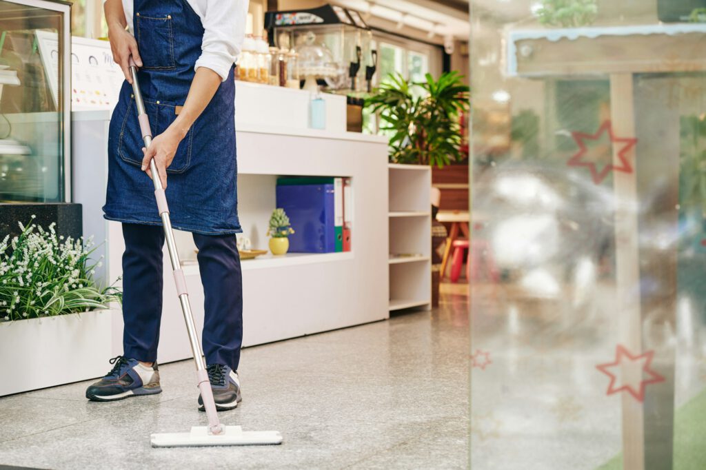 Waiter wiping floor